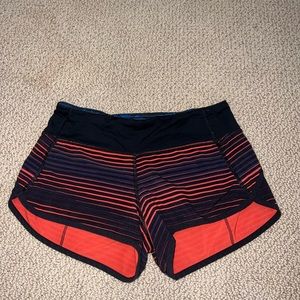 Lululemon speed up shorts. Orange and black striped
